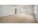 Spacious bedroom with plush carpeting, ceiling fan, and natural light at 1401 Brewer Jackson Ct, Wake Forest, NC 27587