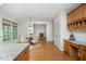 Sunlit breakfast nook with view into living room, featuring table with seating for four at 1401 Brewer Jackson Ct, Wake Forest, NC 27587