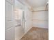 Walk-in closet with shelving, carpet flooring, and an ensuite bathroom at 1401 Brewer Jackson Ct, Wake Forest, NC 27587