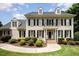 Elegant brick home with a manicured lawn, black shutters, and a charming entrance at 1401 Brewer Jackson Ct, Wake Forest, NC 27587