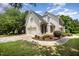 View of two-story home featuring an attached garage, driveway and landscaped yard with green lawn at 1401 Brewer Jackson Ct, Wake Forest, NC 27587