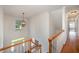 Bright foyer boasts hardwood floors, a decorative light fixture, and a clear view of the front entrance at 1401 Brewer Jackson Ct, Wake Forest, NC 27587