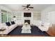 Bright living room with custom built-ins, fireplace, and hardwood floors at 1401 Brewer Jackson Ct, Wake Forest, NC 27587
