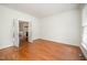 Bright room showcasing gleaming hardwood floors and classic molding details throughout the open layout at 1401 Brewer Jackson Ct, Wake Forest, NC 27587