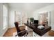 Comfortable office with a view of a staircase through glass french doors at 1401 Brewer Jackson Ct, Wake Forest, NC 27587
