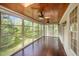 Cozy screened porch with wood ceiling and flooring, perfect for relaxing at 1401 Brewer Jackson Ct, Wake Forest, NC 27587