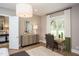 Cozy bedroom with a natural light, a desk, and a comfortable chair perfect for work or relaxation at 1412 Auman Rd, Raleigh, NC 27603