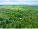 Sprawling green landscape with a home nestled in the trees at 1514 Lawrence Rd, Creedmoor, NC 27522