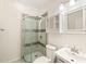 Bathroom featuring neutral tile, glass shower door, vanity and decorative mirror at 1514 Lawrence Rd, Creedmoor, NC 27522