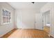 A bright bedroom featuring hardwood floors and ample closet space at 1514 Lawrence Rd, Creedmoor, NC 27522