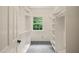 Walk-in closet with built-in shelving and a window at 1514 Lawrence Rd, Creedmoor, NC 27522
