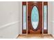 Elegant wood front door with decorative glass and sidelights at 1514 Lawrence Rd, Creedmoor, NC 27522