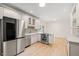 Bright kitchen with stainless steel appliances, updated cabinetry, and a sunlit ambiance with lots of counter space at 1514 Lawrence Rd, Creedmoor, NC 27522