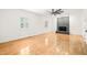 Spacious living room featuring a stone fireplace, natural light, and hardwood floors at 1514 Lawrence Rd, Creedmoor, NC 27522