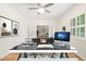 Bright home office with modern desk, white trim, and hardwood floors at 1514 Lawrence Rd, Creedmoor, NC 27522