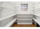 Walk-in pantry with ample shelving, providing plenty of storage space for food and kitchen supplies at 1514 Lawrence Rd, Creedmoor, NC 27522