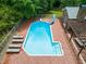 Aerial view of sparkling pool and lounge area in backyard at 1514 Lawrence Rd, Creedmoor, NC 27522