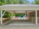 Covered parking area with a view of the beautiful pool in the backyard at 1514 Lawrence Rd, Creedmoor, NC 27522