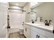 Bright bathroom featuring a double sink vanity, black fixtures, and a tub and shower combination at 152 Chauncey Cir, Chapel Hill, NC 27516