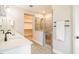 Bathroom with double sink vanity, walk-in shower and open closet at 152 Chauncey Cir, Chapel Hill, NC 27516