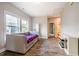 Bedroom with hardwood flooring, a daybed, and an entrance to a bathroom at 152 Chauncey Cir, Chapel Hill, NC 27516