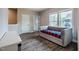 Bedroom with hardwood flooring, a daybed, and multiple windows at 152 Chauncey Cir, Chapel Hill, NC 27516