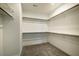 Large walk-in closet with carpet and multiple shelves at 152 Chauncey Cir, Chapel Hill, NC 27516