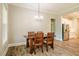 Dining room with wood table and chairs near a well-appointed kitchen at 152 Chauncey Cir, Chapel Hill, NC 27516