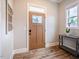 Welcoming entryway featuring wood floors and a stylish front door with glass insert at 152 Chauncey Cir, Chapel Hill, NC 27516