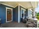 Cozy front porch with decorative chairs, ideal for relaxing and enjoying the outdoors at 152 Chauncey Cir, Chapel Hill, NC 27516
