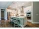 Modern kitchen featuring white cabinets, stainless steel appliances, and a large center island at 152 Chauncey Cir, Chapel Hill, NC 27516