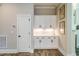 Bright kitchen featuring white cabinets, drawers, and sleek hardware at 152 Chauncey Cir, Chapel Hill, NC 27516