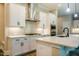 Well-equipped kitchen boasting stainless steel appliances, sleek white countertops, and ample storage at 152 Chauncey Cir, Chapel Hill, NC 27516