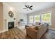 Comfortable living room featuring a fireplace and large windows at 152 Chauncey Cir, Chapel Hill, NC 27516