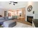 Open-concept living room showcasing the kitchen and fireplace at 152 Chauncey Cir, Chapel Hill, NC 27516