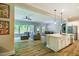 Open concept living room with a view of the kitchen and backyard at 152 Chauncey Cir, Chapel Hill, NC 27516