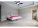 Spacious main bedroom with plush carpet, tray ceiling, and fan at 152 Chauncey Cir, Chapel Hill, NC 27516