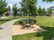 Outdoor seating area in a landscaped park with mature trees at 152 Chauncey Cir, Chapel Hill, NC 27516