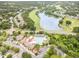 Community aerial view featuring the pool, amenity center, golf course, and lake, with convenient parking areas at 1608 Heritage Links Dr, Wake Forest, NC 27587