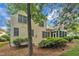 Exterior view highlighting backyard and lush greenery at 1608 Heritage Links Dr, Wake Forest, NC 27587