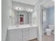Bathroom with double vanity, mirror and separate toilet area, offering convenience and privacy at 1608 Heritage Links Dr, Wake Forest, NC 27587