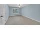Bedroom featuring a window with view of the trees and plush carpet at 1608 Heritage Links Dr, Wake Forest, NC 27587