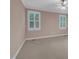 Neutral bedroom with carpet flooring, ceiling fan, and large windows at 1608 Heritage Links Dr, Wake Forest, NC 27587