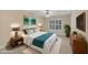 Bright bedroom features a plush bed, a ceiling fan and neutral wall-to-wall carpeting at 1608 Heritage Links Dr, Wake Forest, NC 27587
