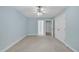 Light blue bedroom with a ceiling fan and neutral carpet at 1608 Heritage Links Dr, Wake Forest, NC 27587
