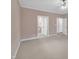 Spacious bedroom with neutral walls, carpet, and multiple doorways at 1608 Heritage Links Dr, Wake Forest, NC 27587