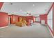 Spacious bonus room with seating and built-in shelving at 1608 Heritage Links Dr, Wake Forest, NC 27587
