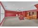 Well-lit bonus room with ample seating and storage at 1608 Heritage Links Dr, Wake Forest, NC 27587