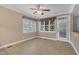 Sunlit dining area with tile flooring, ceiling fan, and access to the outdoors at 1608 Heritage Links Dr, Wake Forest, NC 27587