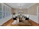 Formal dining room with elegant decor, large window with shutters, and seating for six at 1608 Heritage Links Dr, Wake Forest, NC 27587